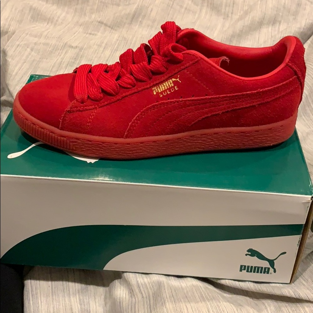 Red suede Pumas